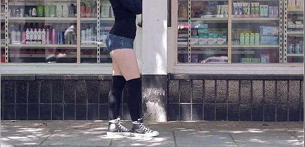  Brunette girl with skateboard flashing in public